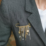 MANIFESTO | Broche dorado con cadenas en acero y charms