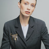 MANIFESTO | Broche dorado con cadenas en acero y charms