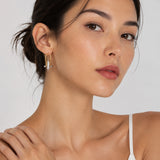 CLAMP | Boucles d'oreilles créoles avec détails structuraux et zircone cubique