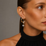 FROST Gold | Boucles d'oreilles asymétriques avec zircone et chaîne